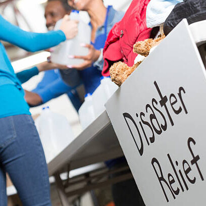 Closeup of a Disaster Relief sign at a center handing out water.